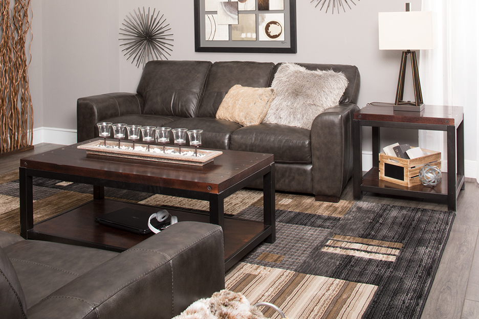 Sofa, rug, wall art, and end tables