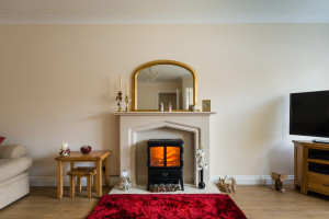 Layered area rugs livingroom