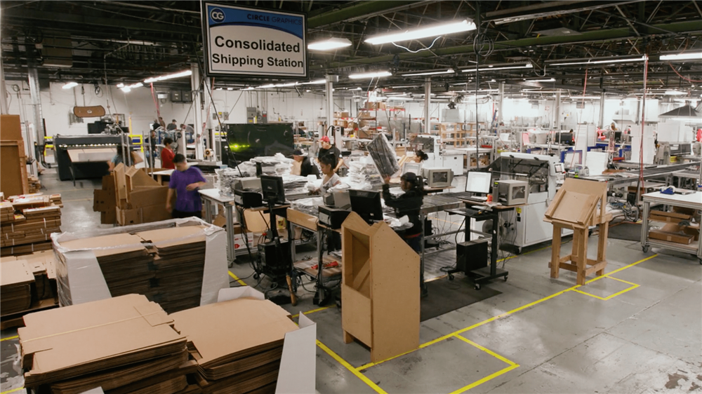 Workers packing canvases for shipping