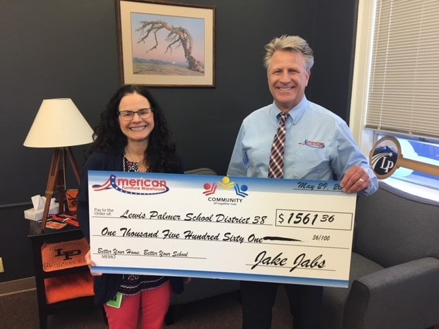 Presenting a check to Lewis-Palmer School District 38