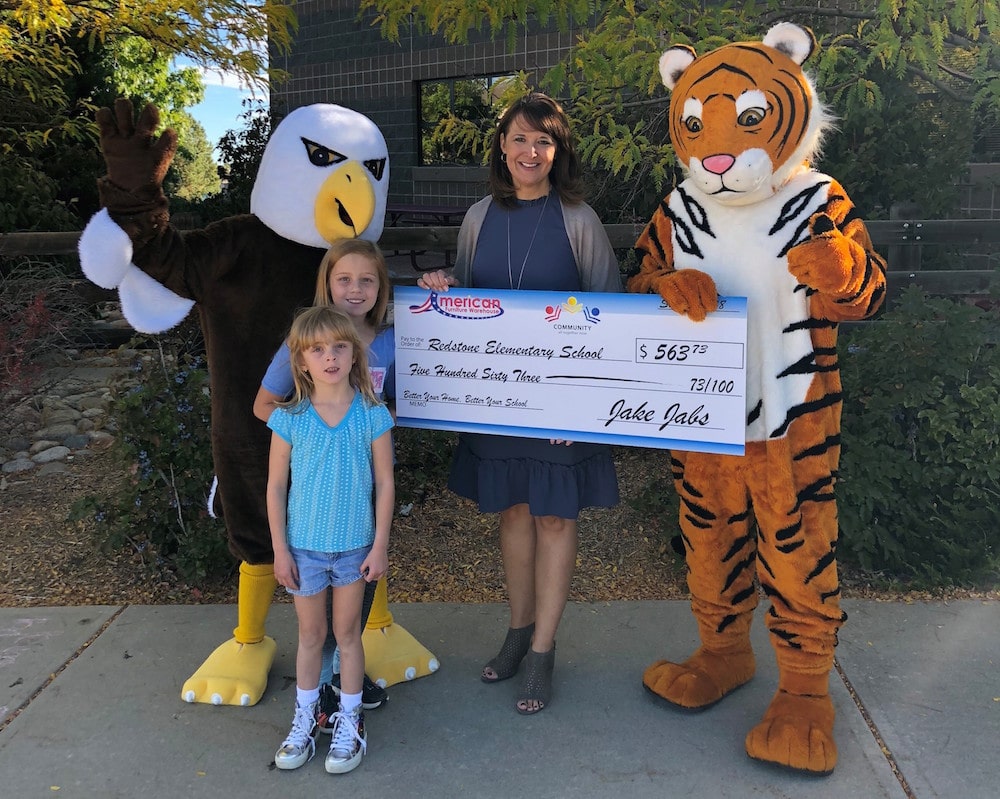 Presenting a check to Redstone Elementary