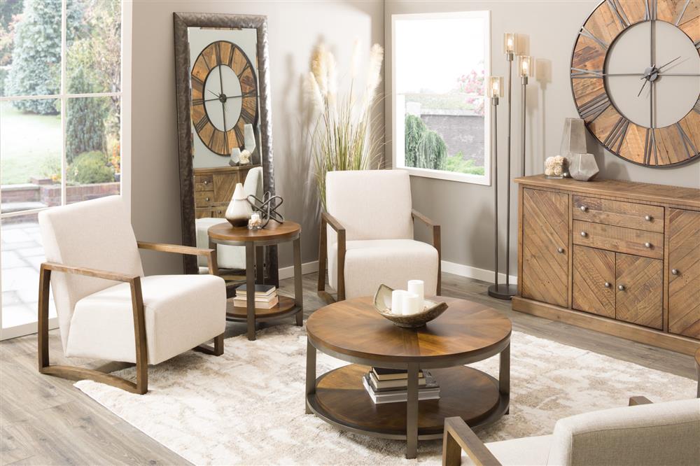 Living room with round wood and metal clock and a round cocktail talbe