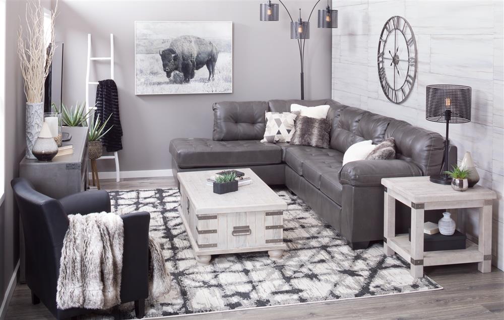 Living room with small grey sectional and lift-top cocktail table